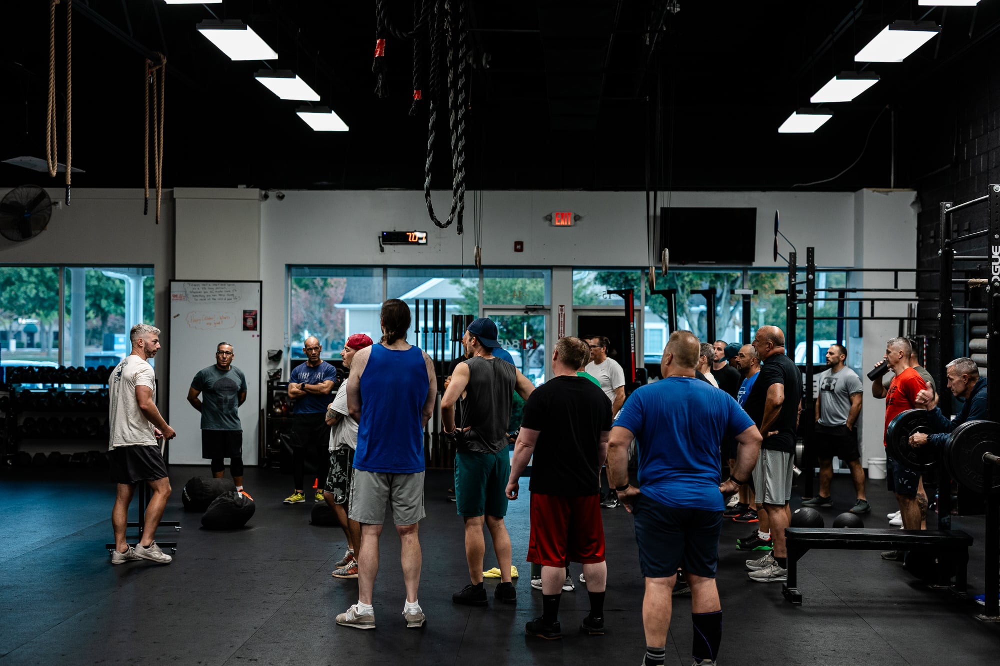 Fathers gathered in a training space at Strong Dad Society