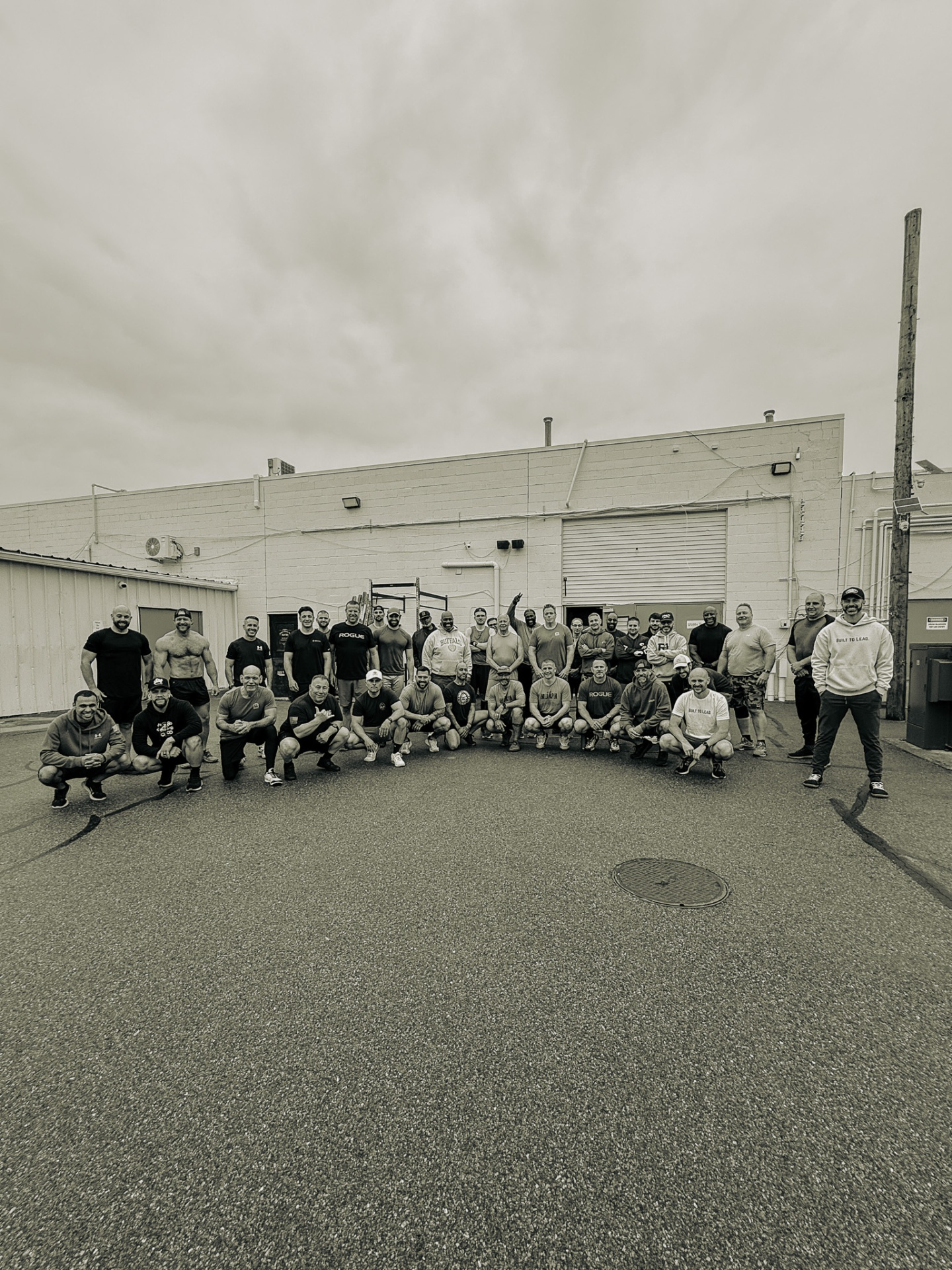Strong Dad Society brotherhood — group photo outside the gym